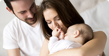 new born baby with parents